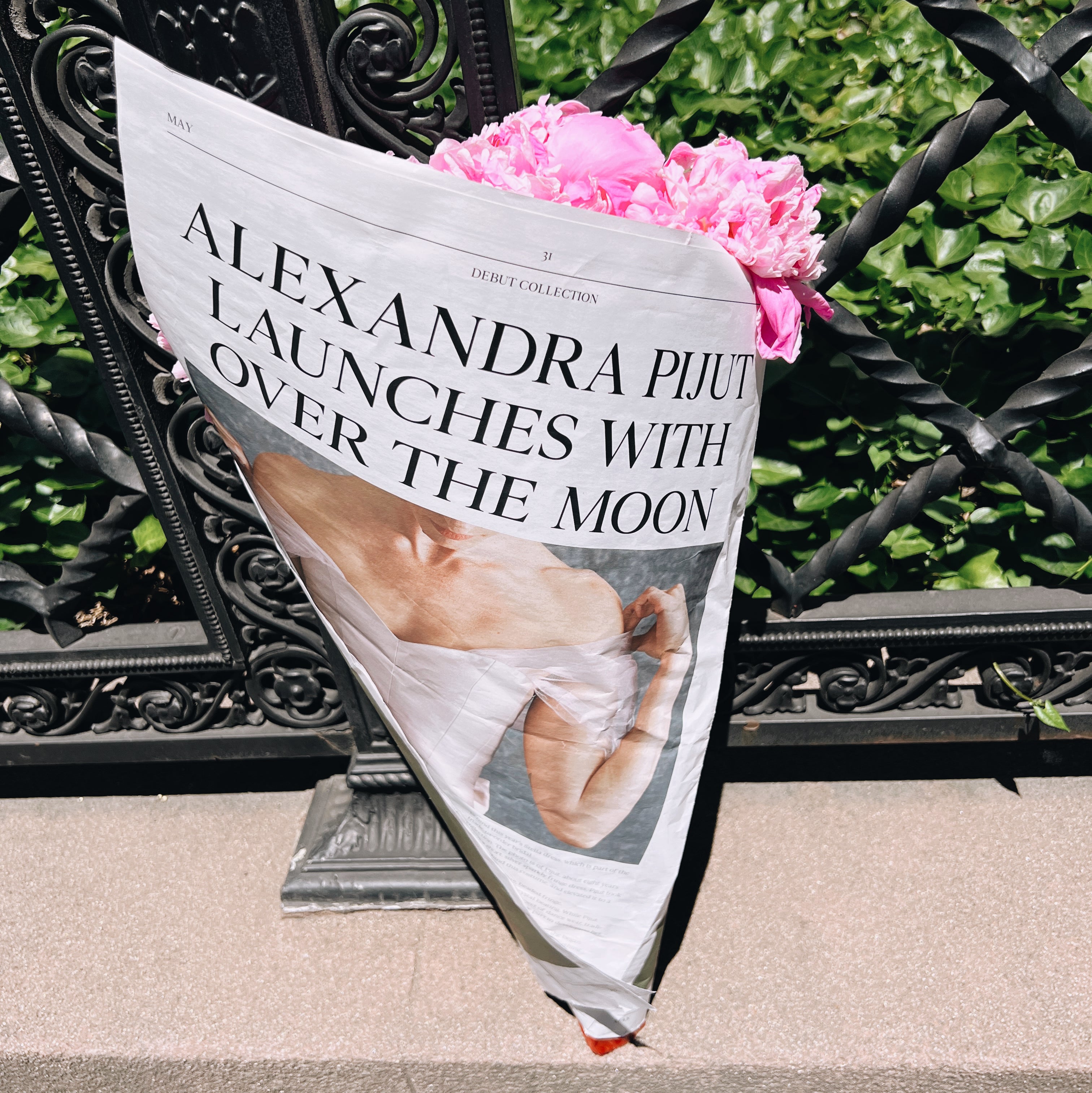 Alexandra Pijut launches exclusively with Over The Moon, newspaper wrapped around flowers. 