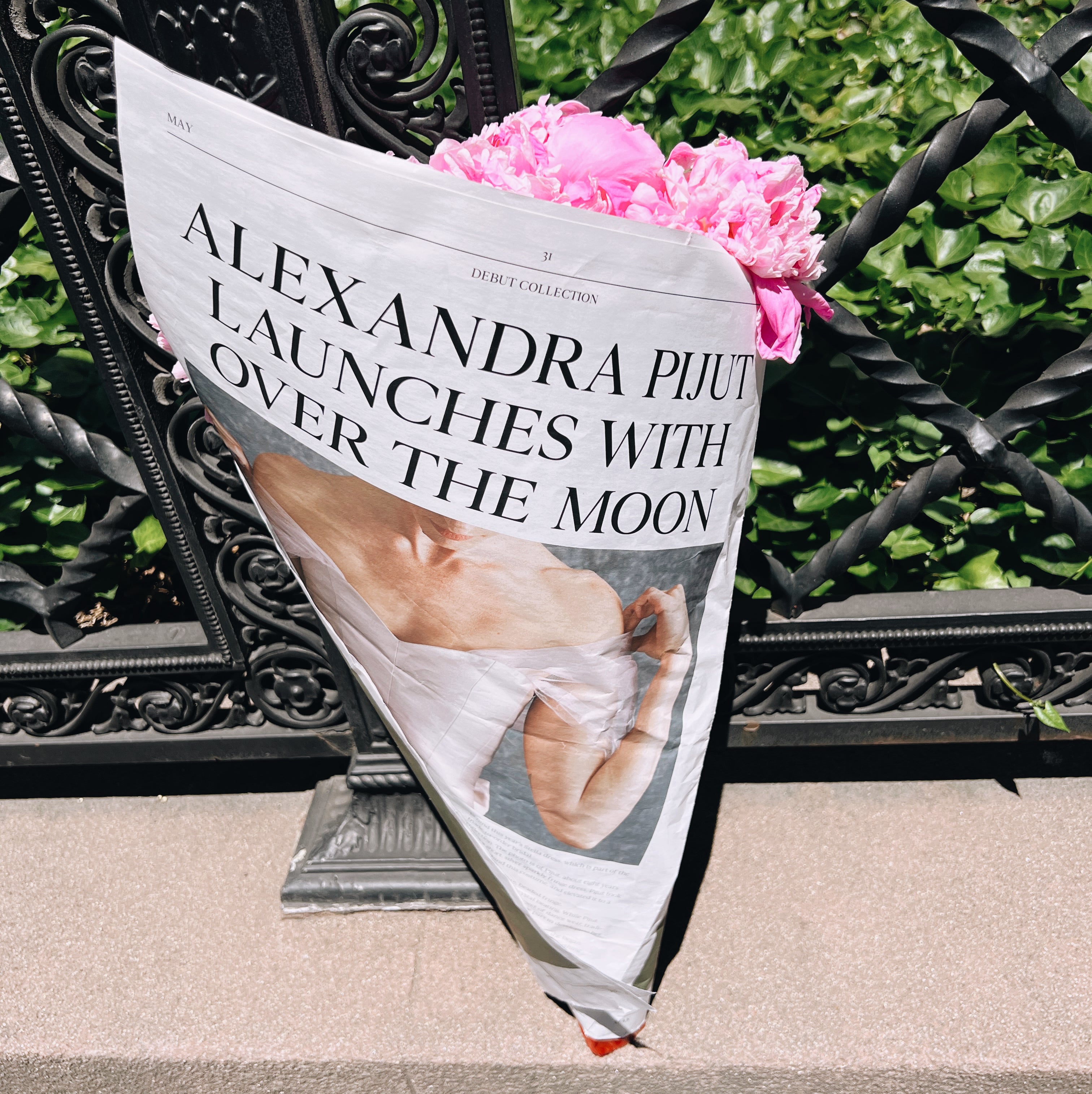 Alexandra Pijut launches exclusively with Over The Moon, newspaper wrapped around flowers.