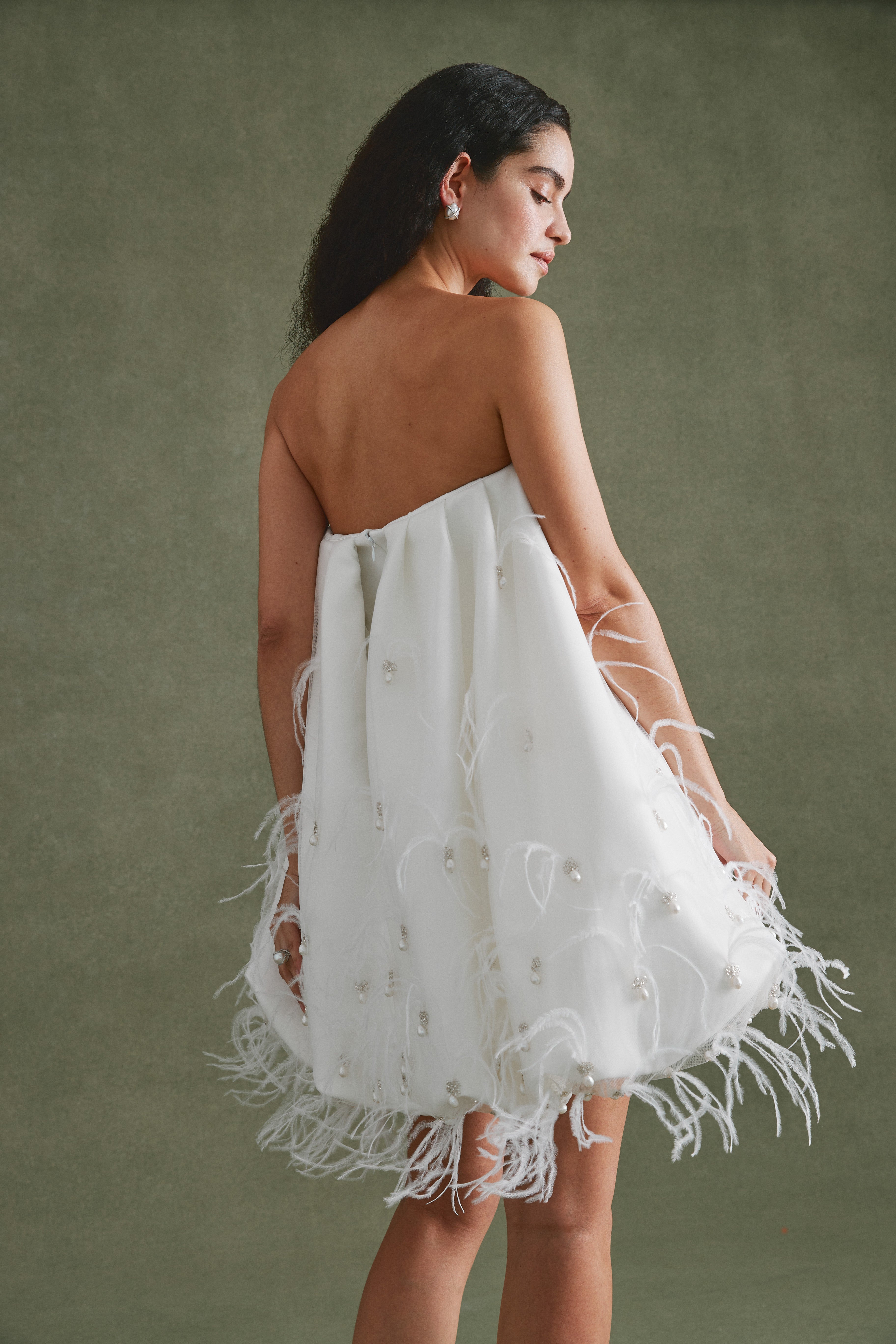 Alexandra Pijut Cloud Dress. Ivory satin mini dress with pearl and feather embellishments. After party, rehearsal dinner outfit.