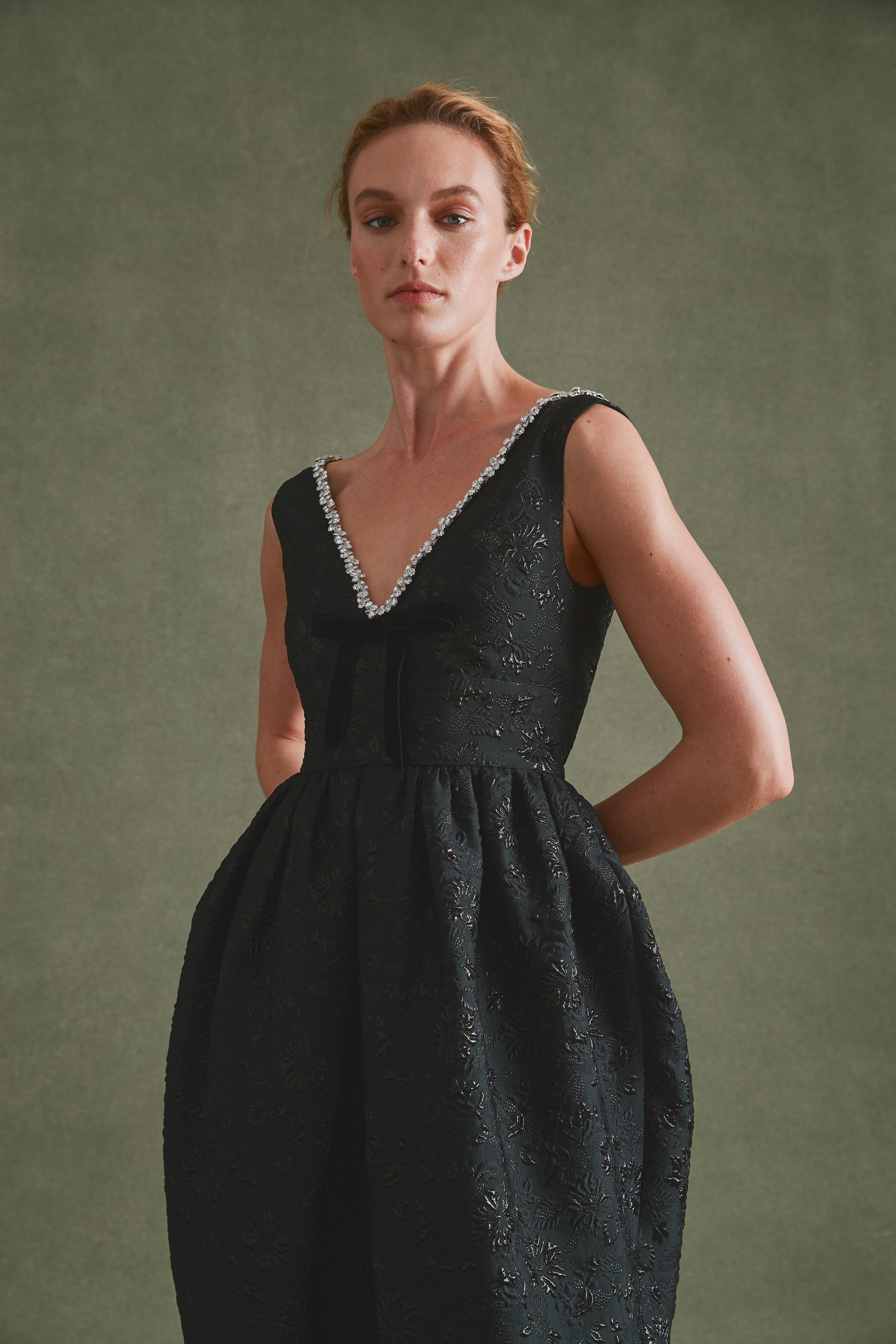 Alexandra Pijut Rainey Dress in black brocade with velvet bow and crystal trim. Black tie, wedding guest, gala outfit. Ankle length.