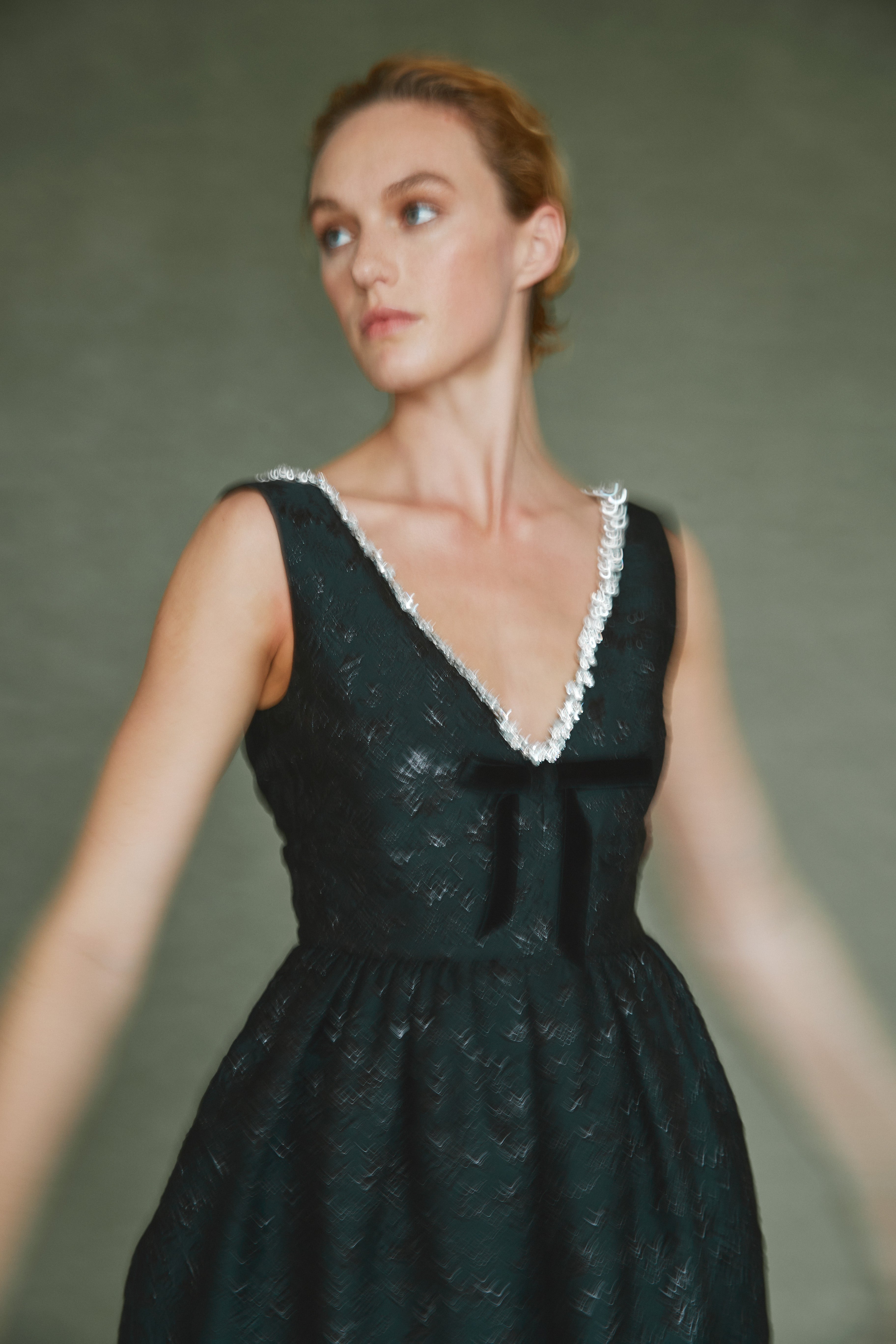 Alexandra Pijut Rainey Dress in black brocade with velvet bow and crystal trim. Black tie, wedding guest, gala outfit. Ankle length.